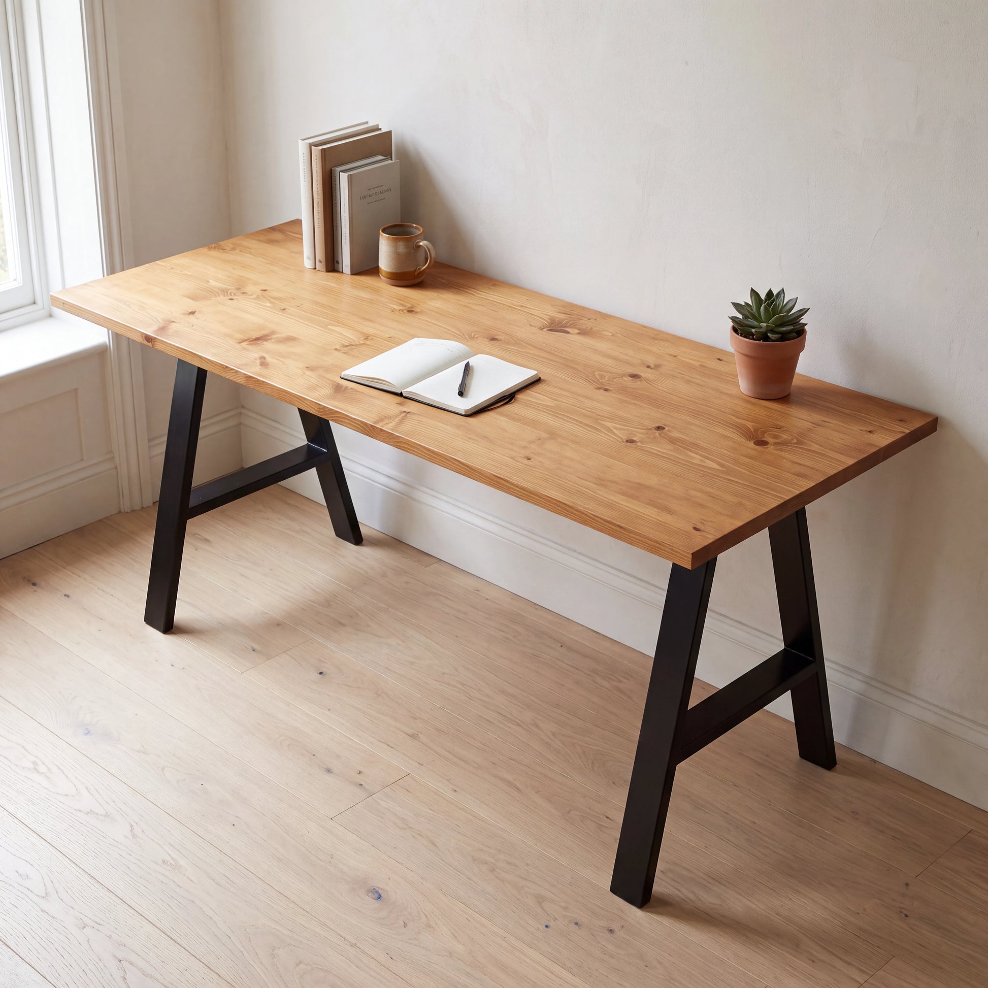 Grove Solid Wood Desk, Cognac finish, black A-frame legs, lifestyle