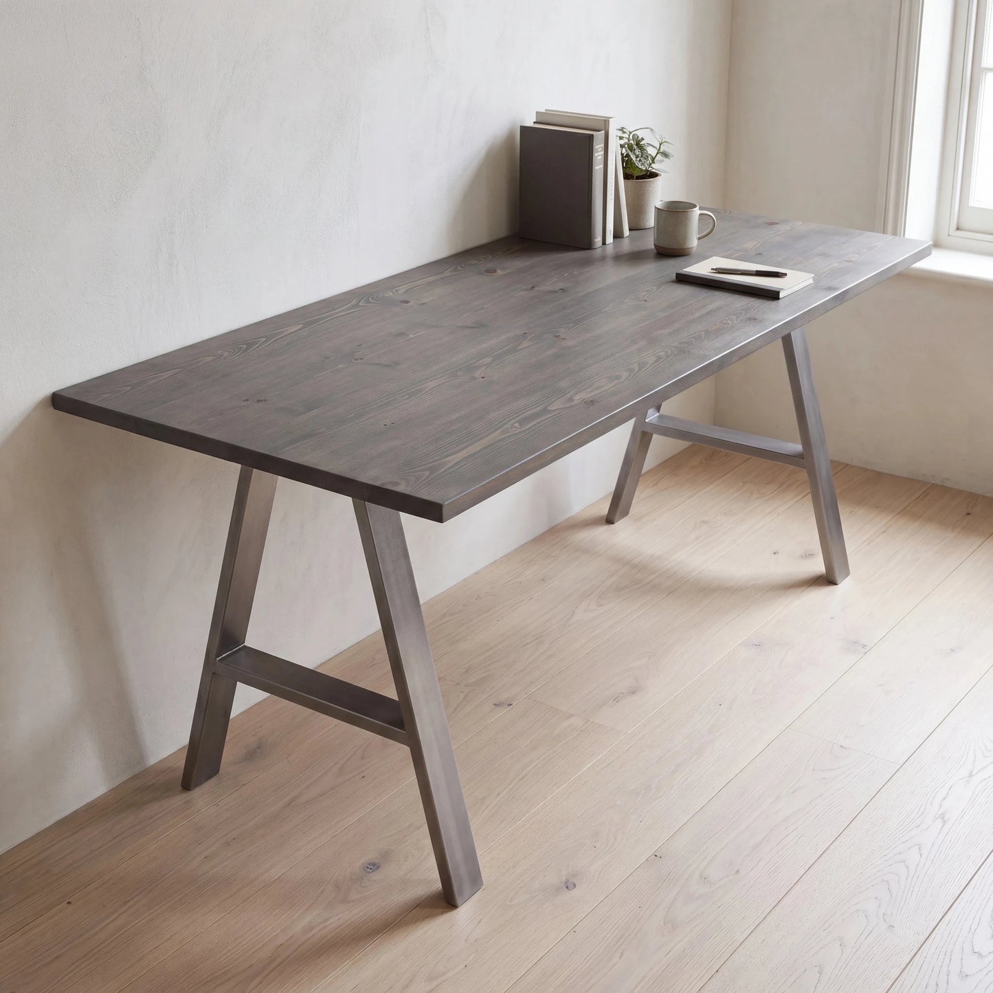 Grove Solid Wood Desk, Graphite finish, steel A-frame legs, lifestyle