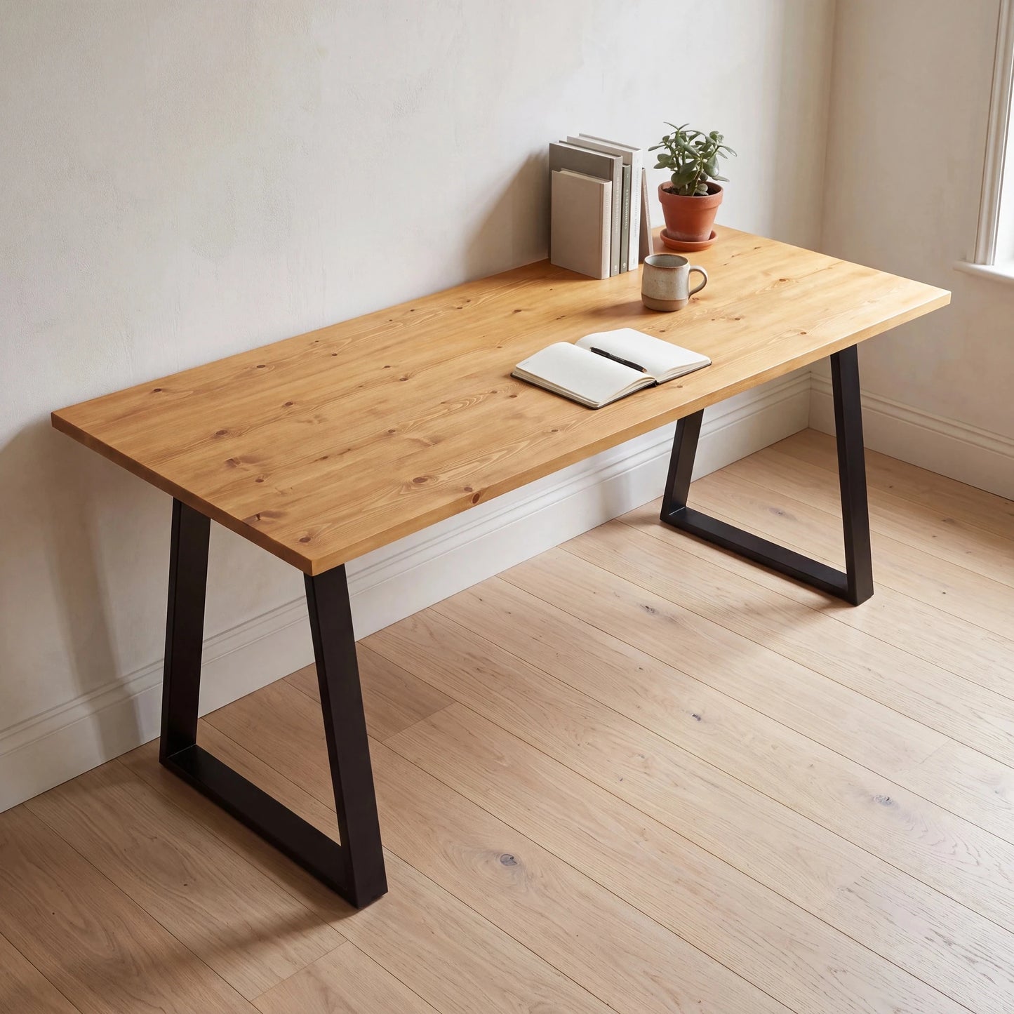 Grove Solid Wood Desk, Honey finish, black trapezium legs, lifestyle