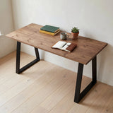 Grove Solid Wood Desk, Tobacco finish, black trapezium legs, lifestyle