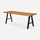 Grove solid wood desk in Cognac with black A-frame legs