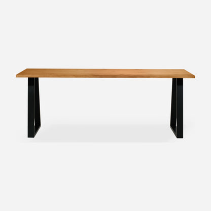 Grove solid wood desk in Cognac with black trapezium legs