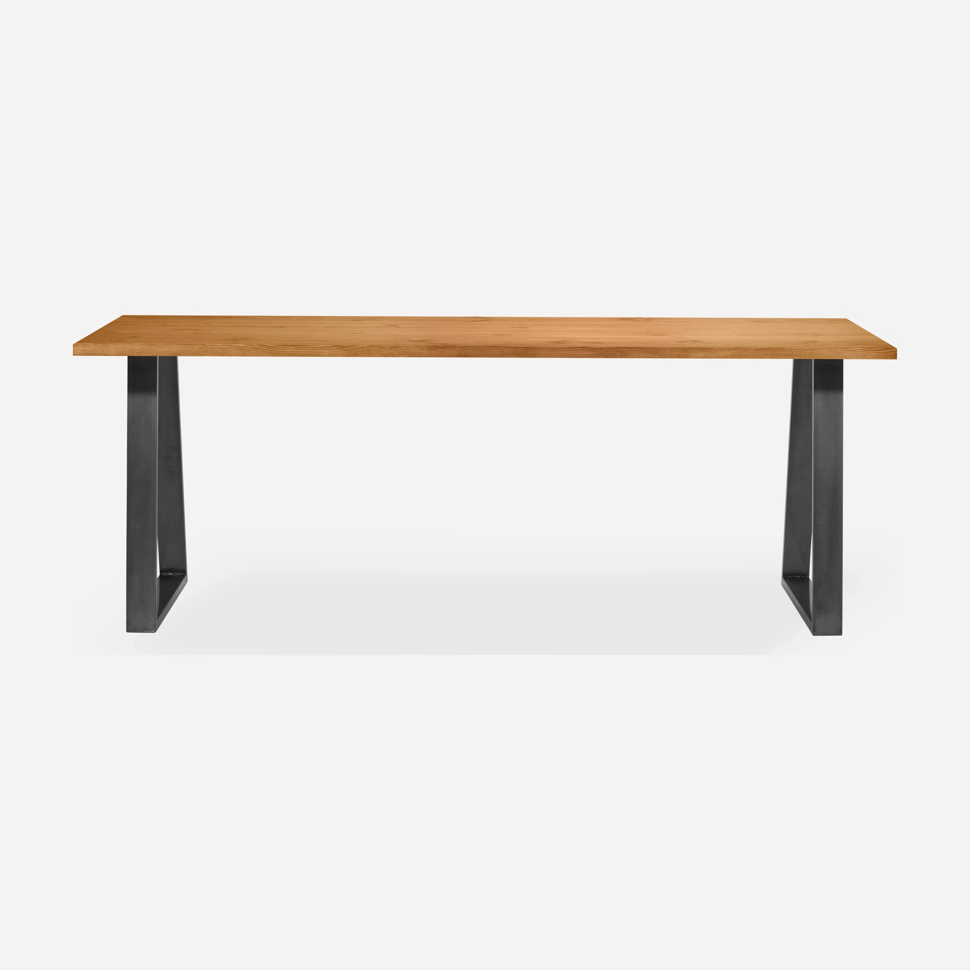 Grove solid wood desk in Cognac with steel trapezium legs