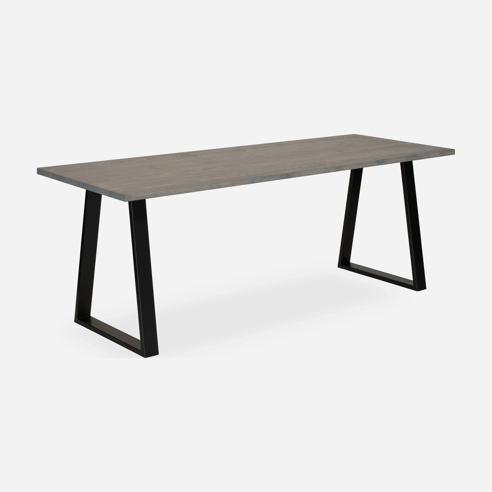 Grove solid wood desk in Graphite with black trapezium legs
