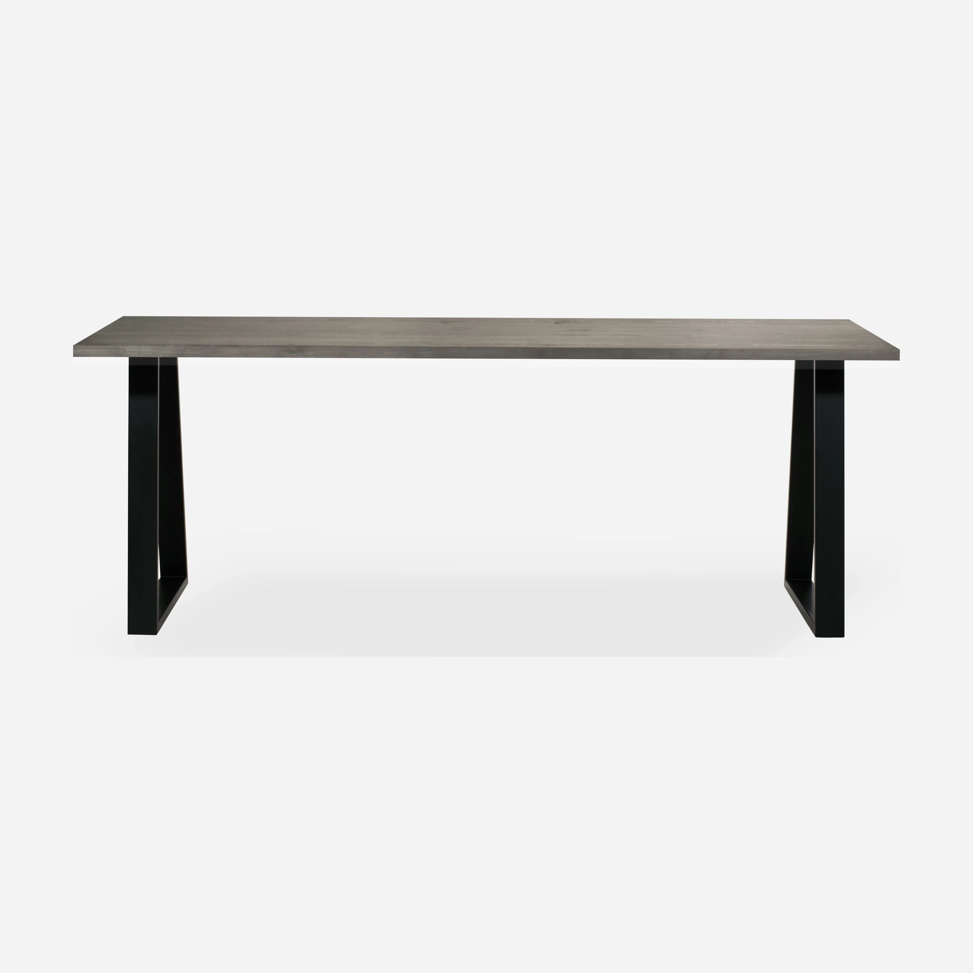 Grove solid wood desk in Graphite with black trapezium legs