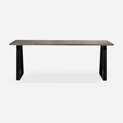 Grove solid wood desk in Graphite with black trapezium legs