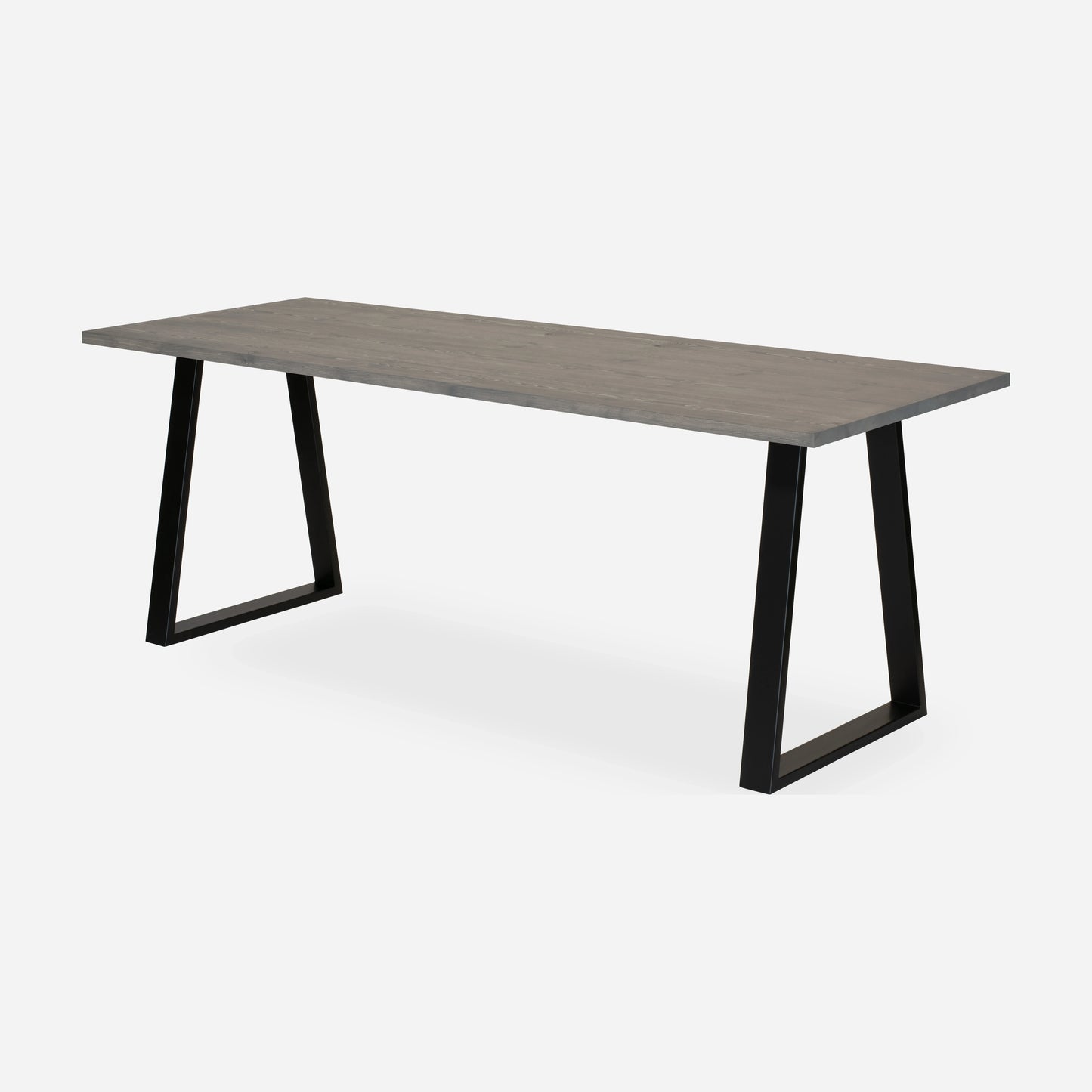 Grove solid wood desk in Graphite with black trapezium legs