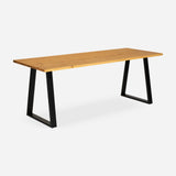 Grove solid wood desk in Honey with black trapezium legs