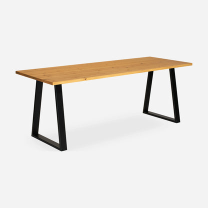 Grove solid wood desk in Honey with black trapezium legs