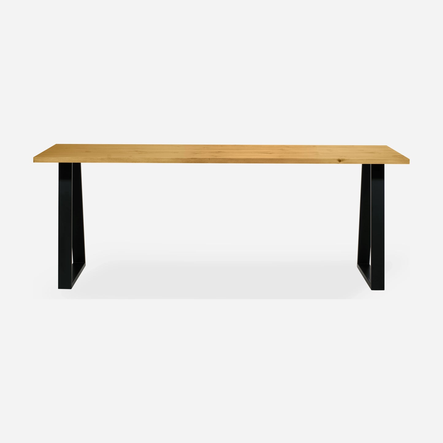 Grove solid wood desk in Honey with black trapezium legs