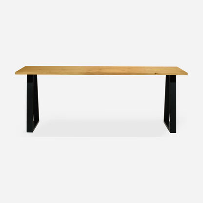 Grove solid wood desk in Honey with black trapezium legs