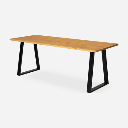 Grove solid wood desk in Honey with black trapezium legs
